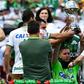 Brazilian Chapecoense goalkeeper Jackson Follmann (C), holds up the Copa Sudamericana trophy before a friendly match against Palmeiras