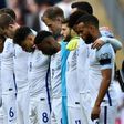 England players observe a minute of silence for the victims of the Westminster terror attack ahead of the World Cup 2018 qualification football match at Wembley Stadium