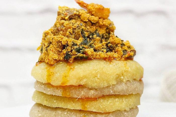 Eba topped with egusi soup