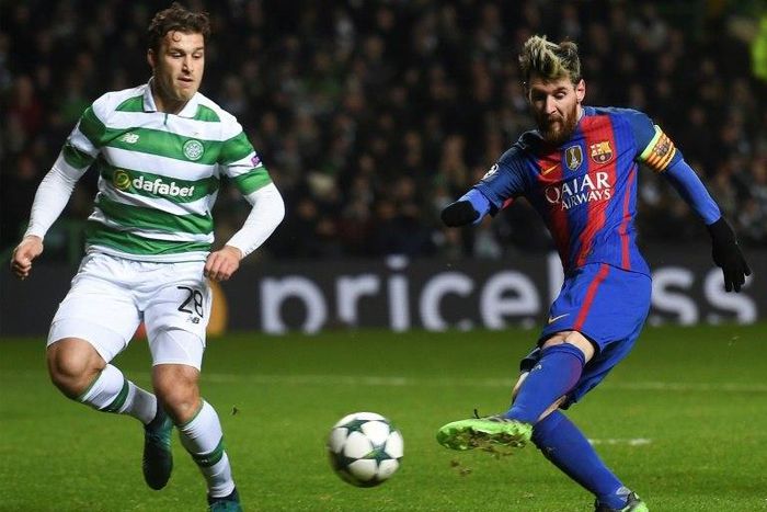 Barcelona's striker Lionel Messi (R) shoots to score against Celtic on November 23, 2016
