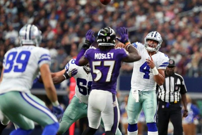 Dak Prescott throws a pass to Gavin Escobar of the Dallas Cowboys during the second half against the Baltimore Ravens on November 20, 2016 in Arlington, Texas