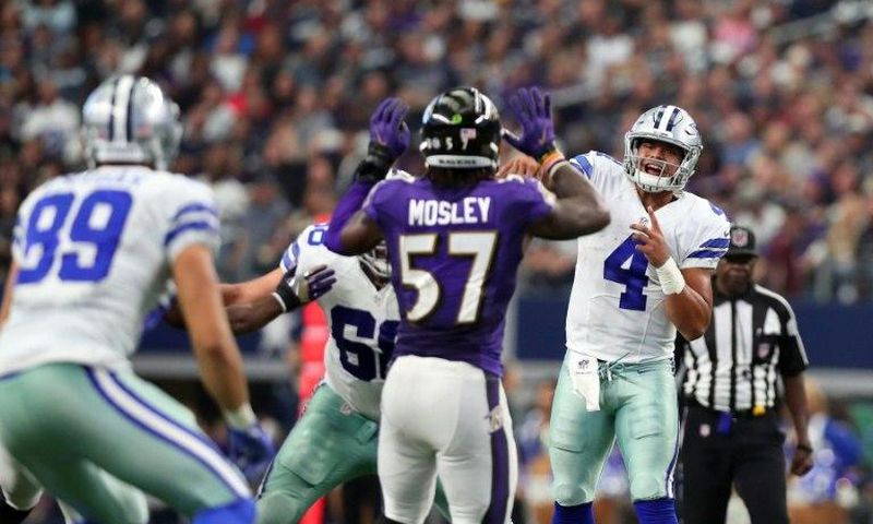 Dak Prescott throws a pass to Gavin Escobar of the Dallas Cowboys during the second half against the Baltimore Ravens on November 20, 2016 in Arlington, Texas