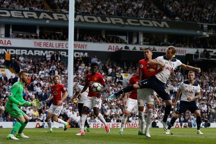 Tottenham Hotspur's striker Harry Kane (R) scores the second goal during the English Premier League football match between Tottenham Hotspur and Manchester United at White Hart Lane in London, on May 14, 2017