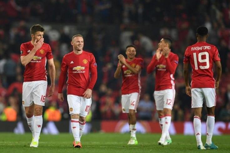 (L-R) Manchester United celebrate winning their UEFA Europa League semi-final, second-leg football match against Celta Vigo at Old Trafford stadium in Manchester, north-west England, on May 11, 2017