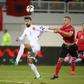 Albania's Ansi Agolli (R) clashes with Spain's Gerard Pique in Shkoder, on October 9, 2016