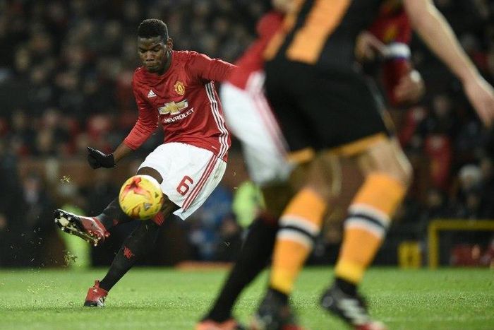 Manchester United's midfielder Paul Pogba strikes the ball as he takes a free-kick during the EFL Cup semi-final football match against Hull City January 10, 2017