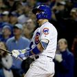 Javier Baez of the Chicago Cubs hits a home run in the eighth inning against the San Francisco Giants, at Wrigley Field in Chicago, Illinois, on October 7, 2016