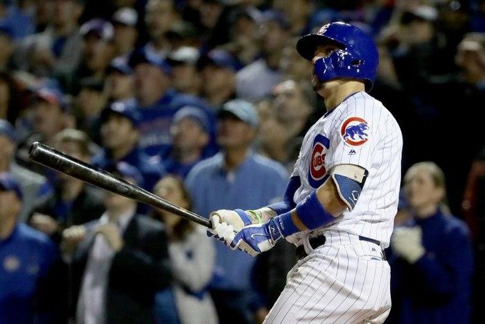 Javier Baez of the Chicago Cubs hits a home run in the eighth inning against the San Francisco Giants, at Wrigley Field in Chicago, Illinois, on October 7, 2016