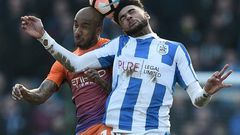 Huddersfield Town's Philip Billing (R) vies with Manchester City's Fabian Delph during their English FA Cup fifth round match on February 18, 2017