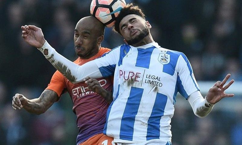 Huddersfield Town's Philip Billing (R) vies with Manchester City's Fabian Delph during their English FA Cup fifth round match on February 18, 2017