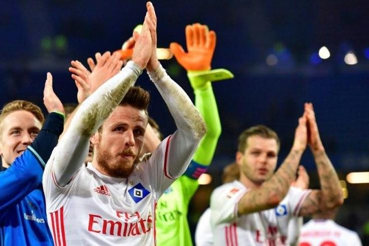 Hamburg players celebrate after the German First division Bundesliga football match between Hamburg SV and Hertha Berlin, on March 5, 2017