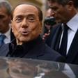 Former Italian prime minister Silvio Berlusconi leaves after voting in a referendum on constitutional reforms in Rome on December 4, 2016