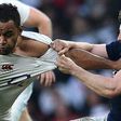 England's Billy Vunipola (L) is tackled as he runs with the ball during the Six Nations international rugby union match against Scotland on March 11, 2017