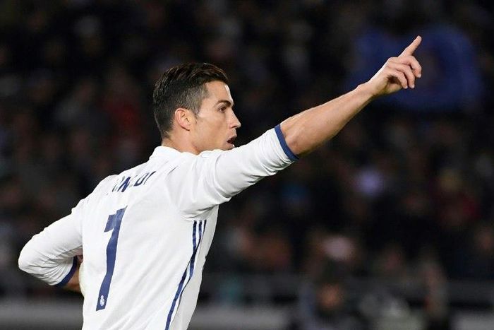 Real Madrid's Cristiano Ronaldo celebrates scoring a penalty during the Club World Cup final against Japan's Kashima Antlers in Yokohama on December 18, 2016