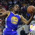 Kevin Durant of the Golden State Warriors grabs a rebound against the Los Angeles Lakers during their pre-season game at T-Mobile Arena in Las Vegas, Nevada, on October 15, 2016