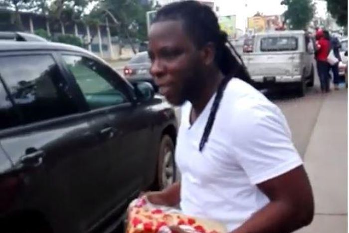 Edem selling A1 Bread on the street