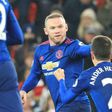 Manchester United's Wayne Rooney (C) celebrates scoring an equalising goal and his 250th goal for Manchester United making him the club's all-time record scorer during the English Premier League football match against Stoke City on January 21, 2017
