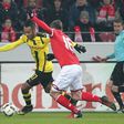 Dortmund's forward Pierre-Emerick Aubameyang (L) and Mainz' defender Stefan Bell vie for the ball during the German first division Bundesliga football match between FSV Mainz 05 and Borussia Dortmund in Mainz, central Germany, on January 29, 2017