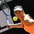Maria Sharapova of Russia returns the ball to Christina McHale of US during their tennis match at the ATP Tennis Open tournament at the Foro Italico in Rome May 15, 2017