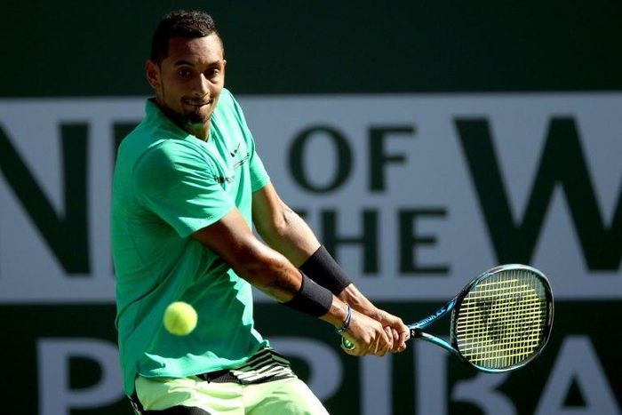 Nick Kyrgios of Australia returns a shot to Novak Djokovic of Serbia during the BNP Paribas Open at the Indian Wells Tennis Garden on March 15, 2017 in Indian Wells, California