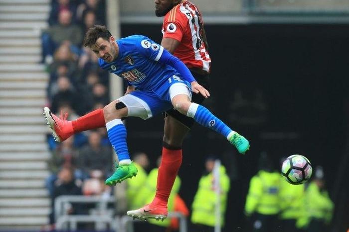 Sunderland's Victor Anichebe (R) challenges Bournemouth's English defender Adam Smith (L) during their Premier league match at the Stadium of Light in Sunderland, north-east England on April 29, 2017