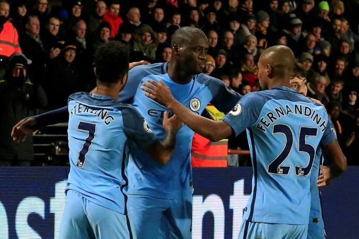 Manchester City's Yaya Toure (C) celebrates scoring a goal during their English Premier League match against Hull City, at the KCOM Stadium in Kingston upon Hull, on December 26, 2016