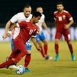Qatar's striker Akram Afif is marked by Russia's defender Fedor Koudryashov (L) during the International friendly match between Qatar and Russia at the Jassim Bin Hamad Stadium in Doha on November 10, 2016
