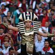 Egyptian fans cheer at the Borg el-Arab Stadium near Alexandria, on November 13, 2016