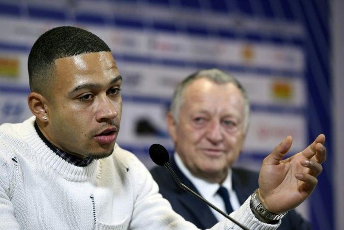 Lyon's new Dutch forward Memphis Depay (left) addresses a press conference in the French city on January 20, 2017