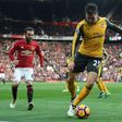 Arsenal's defender Carl Jenkinson (C) vies with Manchester United's striker Anthony Martial (R) and midfielder Juan Mata during the English Premier League football match November 19, 2016