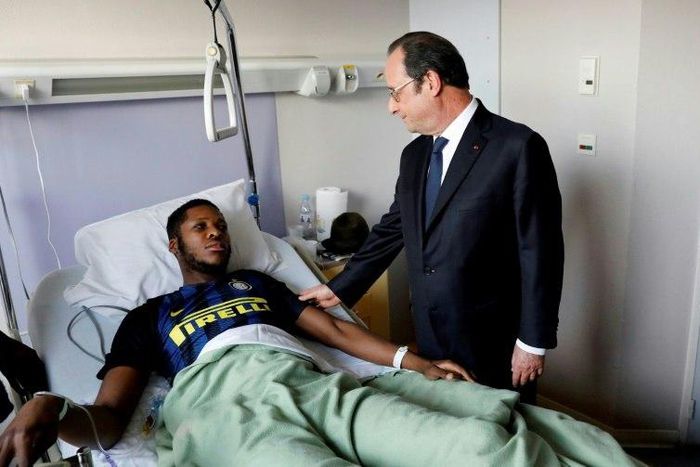 On February 7, 2017, French President Francois Hollande (R) visits a youth worker identified only as Theo, who required major surgery after his arrest, when he claims a police officer sodomized him with his truncheon