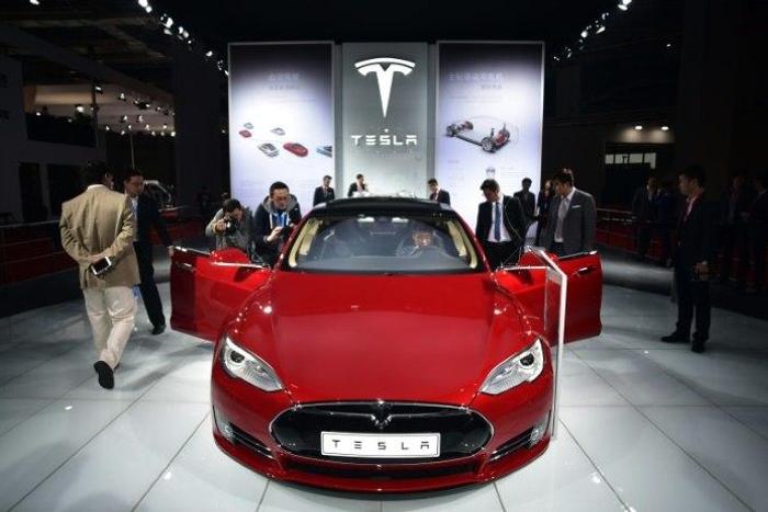 A Tesla Model S P85d on display at the 2015 Shanghai auto show. Electric vehicle sales have been government-subsidised partly to help reduce China's notorious air pollution, and the Chinese market is now the world's biggest and growing quickly