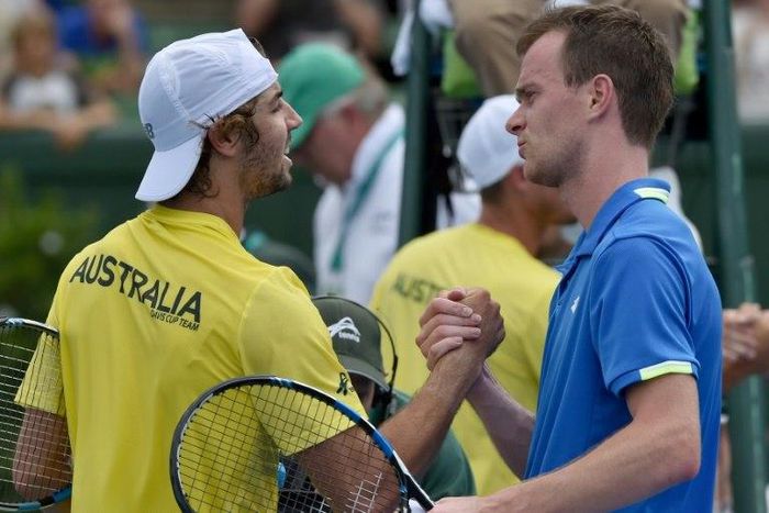 Jordan Thompson of Australia shakes hands with Jan Satral of the Czech Republic after winning his Davis Cup World Group match, at Kooyong in Melbourne, on February 5, 2017