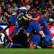 Barcelona players pile onto Sergi Roberto after his winning goal in the Champions League match against Paris Saint-Germain at the Nou Camp stadium on March 8, 2017