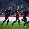 AC Milan's players celebrate after winning the Italian Serie A match against Crotone on December 4, 2016 at the 'San Siro Stadium' in Milan