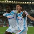 Marseille's Bafetimbi Gomis (L) celebrates after scoring a goal with teammate Florian Thauvin during their French Ligue 1 match against Bordeaux, at the Matmut Atlantique stadium in Bordeaux, on May 14, 2017