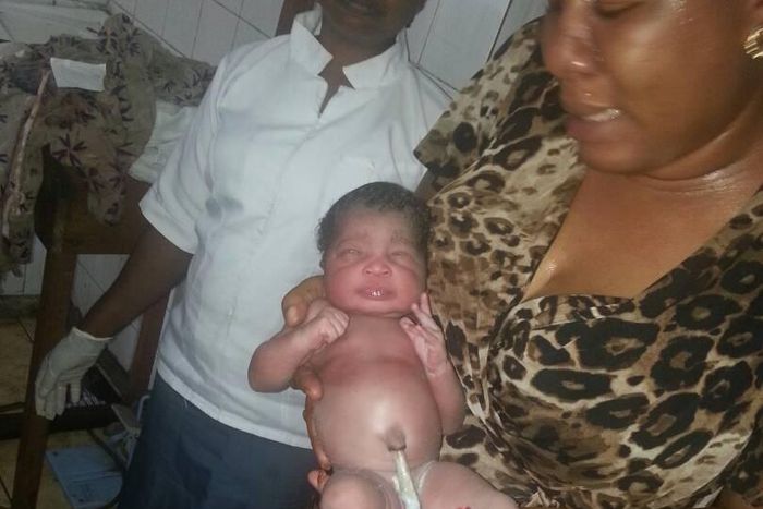 Juliet Chime with the rescued baby