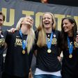 Members of the US Women's football team attend a World Cup championship victory rally in Los Angeles, California in 2015 - they are the first team to win the championship three times