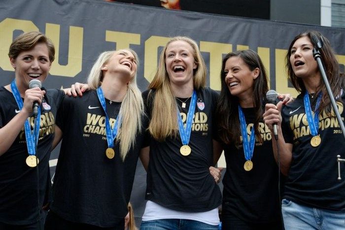 Members of the US Women's football team attend a World Cup championship victory rally in Los Angeles, California in 2015 - they are the first team to win the championship three times