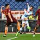Makeshift Napoli forward Dries Mertens (C) shoots as Roma defenders Kostas Manolas (L) and Antonio Rudiger look on during Italian Serie A match at the Olympic Stadium in Rome on March 4, 2017