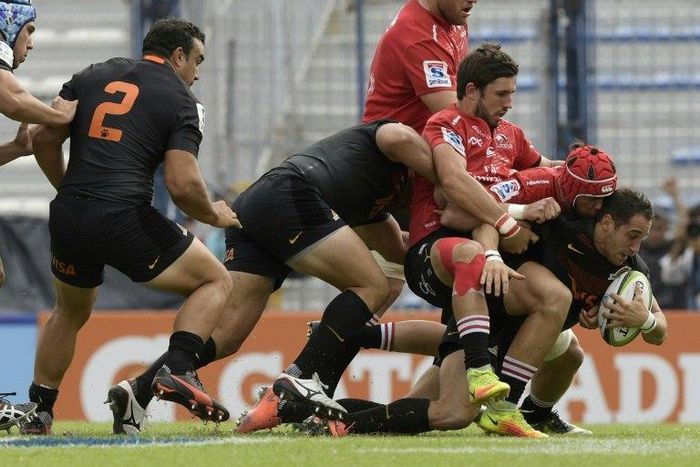 Argentina's Joaquin Tuculet (R) is tackled by South Africa's Warren Whiteley (2-R) and Jacques Nel during their match in Buenos Aires on March 11, 2017