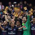 Paris Saint-Germain's Thiago Silva (C) holds the trophy as he celebrates with teammates after winning their French League Cup final against Monaco (ASM) on April 1, 2017