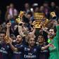 Paris Saint-Germain's Thiago Silva (C) holds the trophy as he celebrates with teammates after winning their French League Cup final against Monaco (ASM) on April 1, 2017