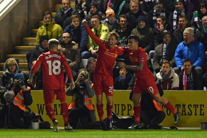 Liverpool's Lucas Leiva (C) celebrates with teammates after scoring the opening goal of their English FA Cup replay football match against Plymouth Argyle on January 18, 2017