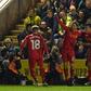 Liverpool's Lucas Leiva (C) celebrates with teammates after scoring the opening goal of their English FA Cup replay football match against Plymouth Argyle on January 18, 2017