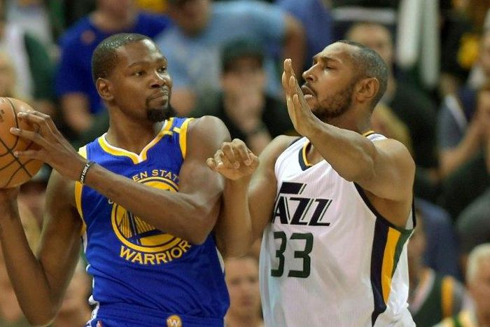 Boris Diaw of the Utah Jazz defends against Kevin Durant of the Golden State Warriors in Game Three of the Western Conference Semifinals