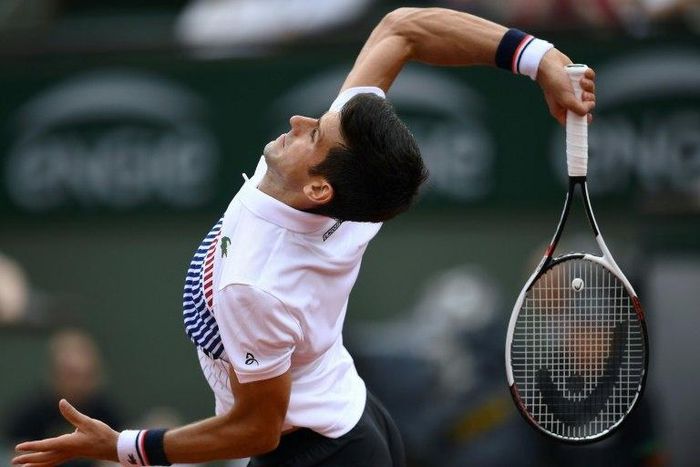 Serbia's Novak Djokovic returns the ball to Spain's Marcel Granollers during their tennis match at the Roland Garros 2017 French Open on May 29, 2017 in Paris