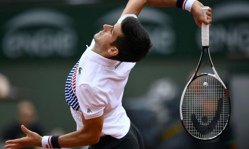 Serbia's Novak Djokovic returns the ball to Spain's Marcel Granollers during their tennis match at the Roland Garros 2017 French Open on May 29, 2017 in Paris