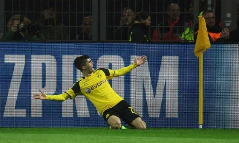 Borussia Dortmund's Christian Pulisic celebrates scoring a goal during their UEFA Champions League match against Benfica, in Dortmund, on March 8, 2017