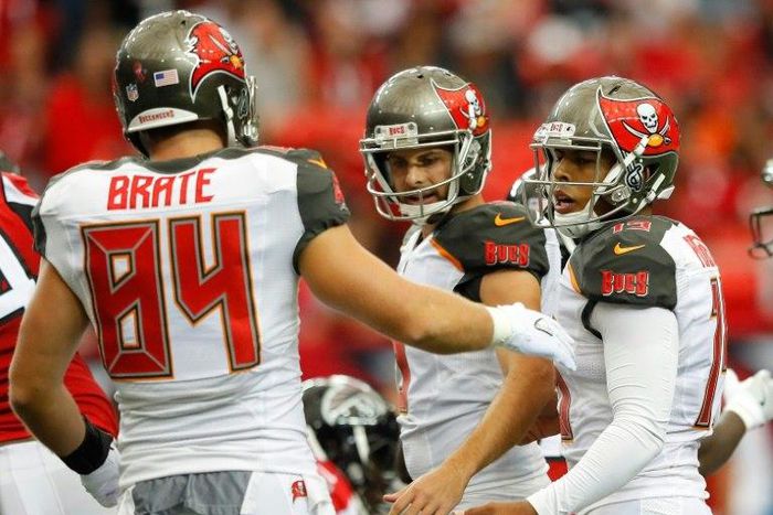 Roberto Aguayo (R) of the Tampa Bay Buccaneers is congratulated by teammates after kicking a field goal during a NFL game at Georgia Dome in Atlanta, in September 2016